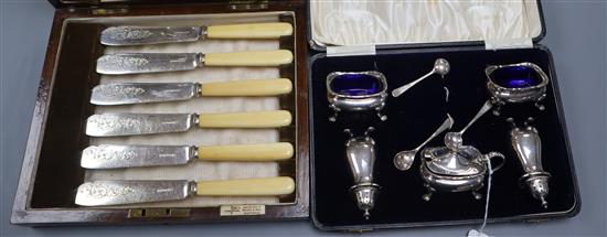 A five-piece silver cruet set (cased) and twelve pairs of plated fish eaters with bone handles in mahogany case